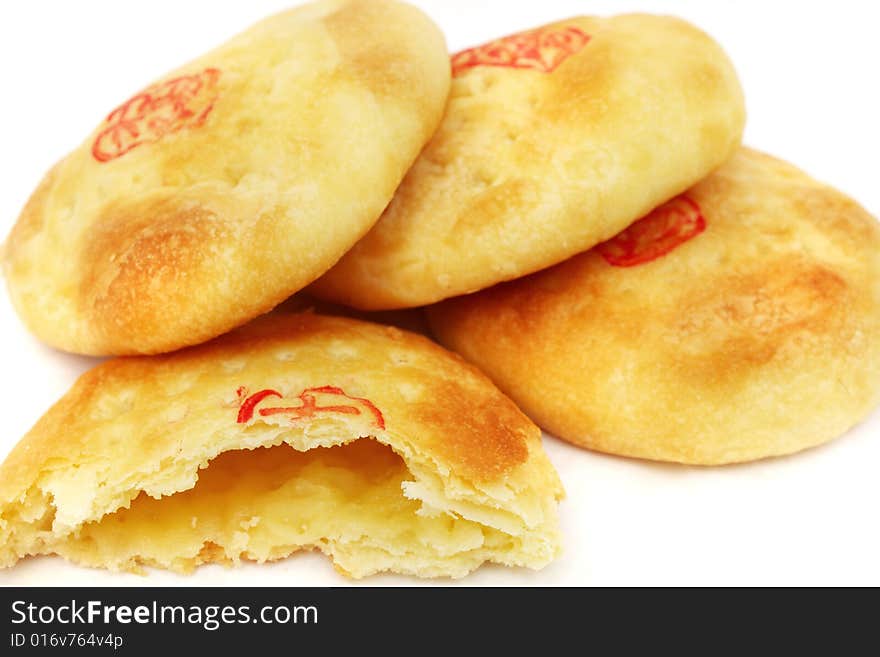 Close up of Chinese cream pastry stacked together.