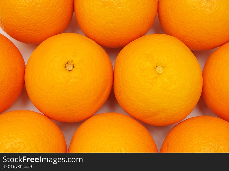 Close up of many oranges as fruit background.