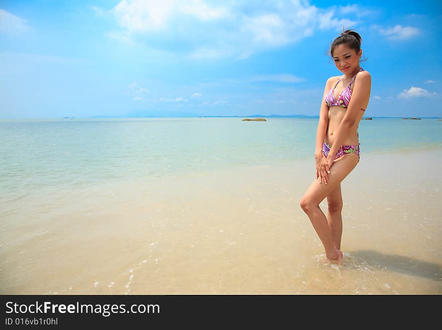 Beautiful Asian Woman On A Beach