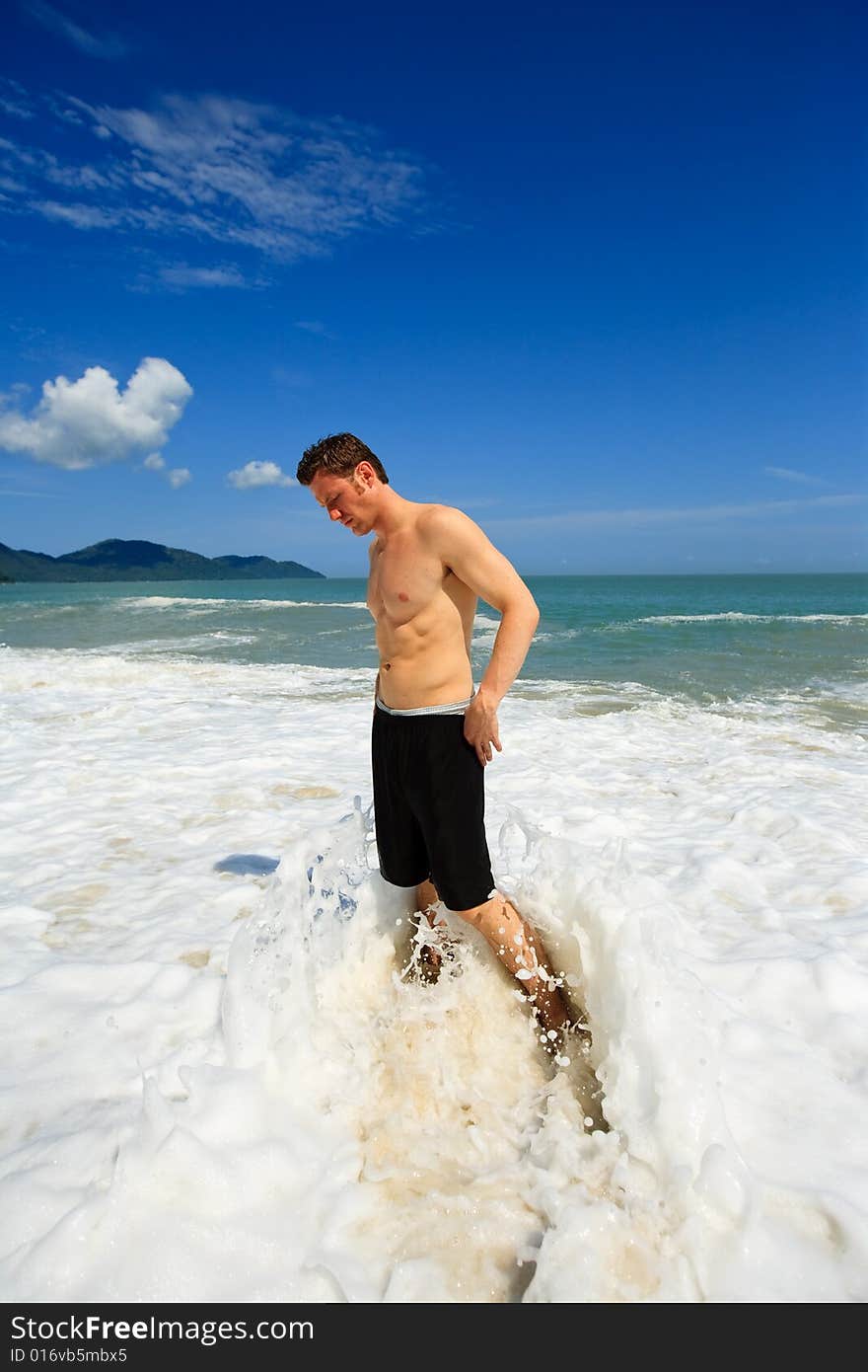 Man standing on exotic beach