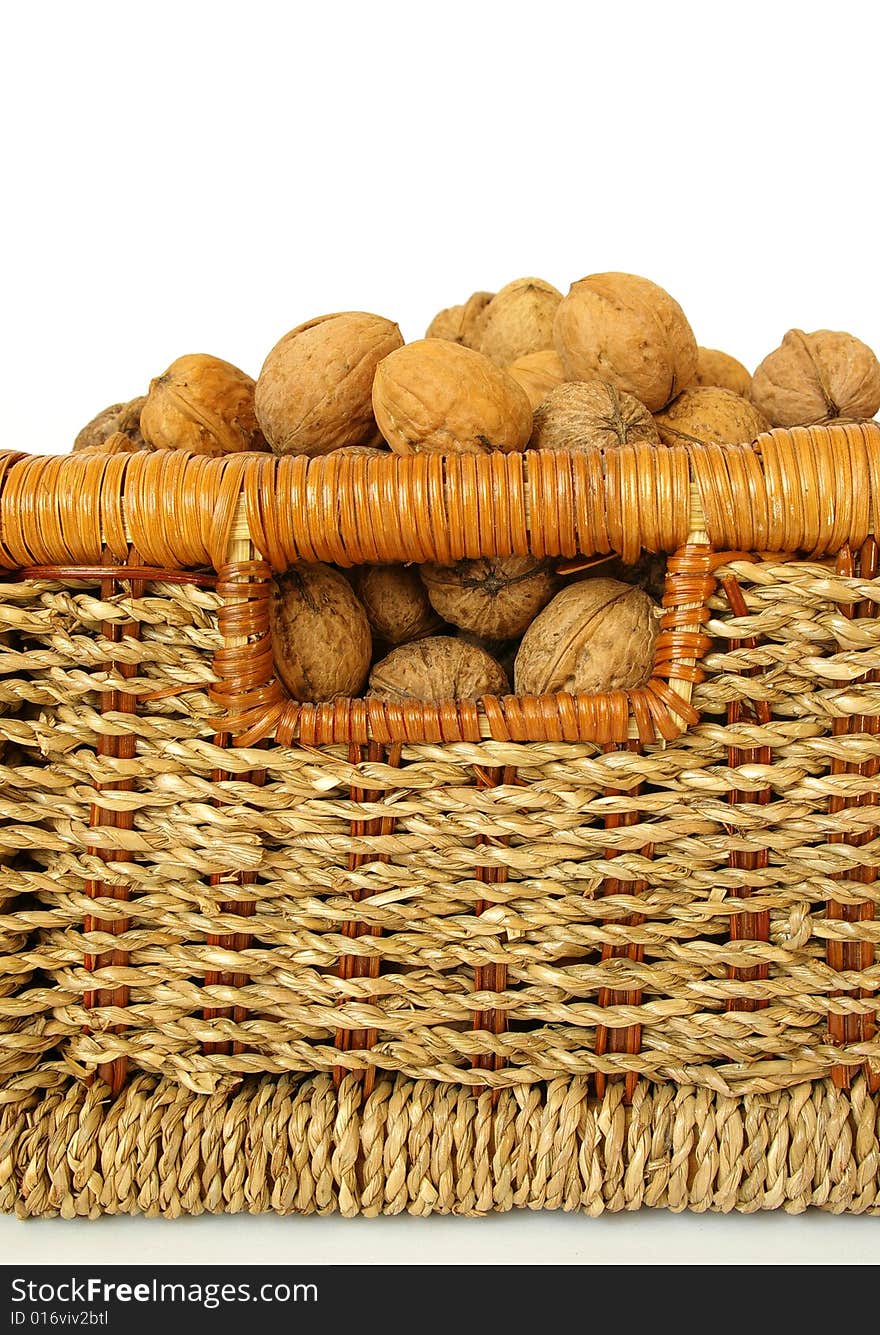 Bakest of nuts isolated on white background. Bakest of nuts isolated on white background