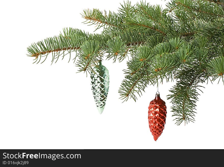 Fir tree branch with decoration on a white background. Close up. Christmas decoration.