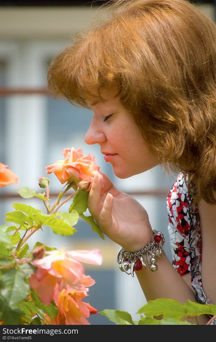 The Girl Smells A Rose Bud