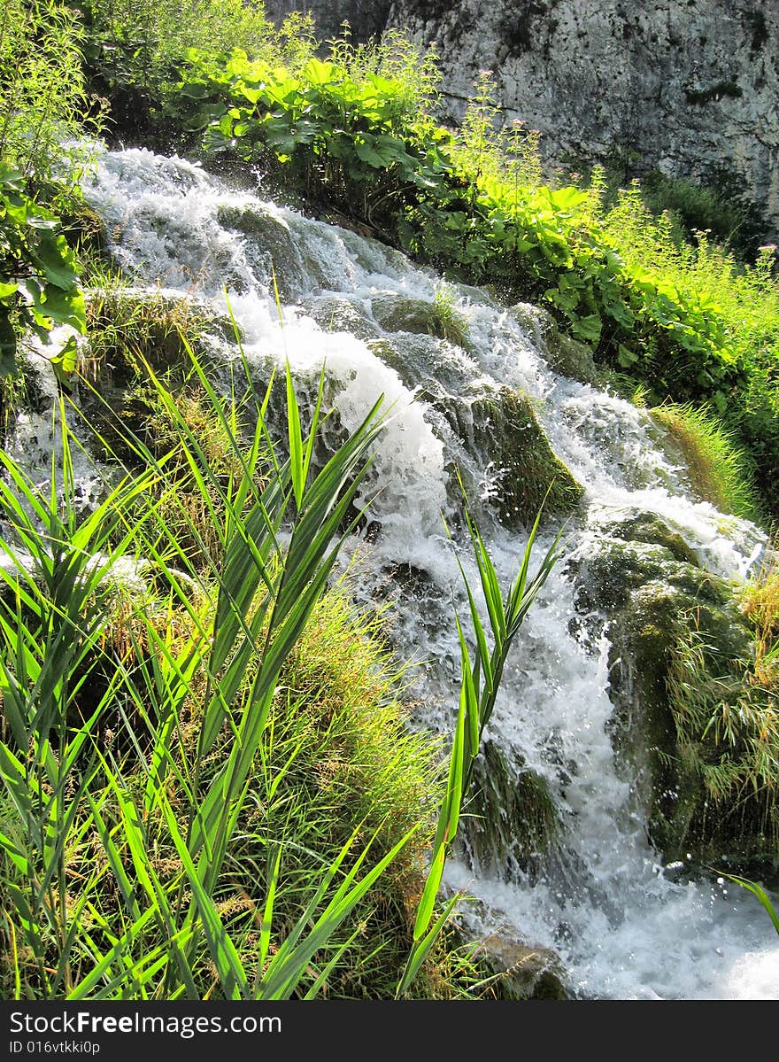 Fast stream. Croatia. Summer. Plitvitsky lakes. Splashes.