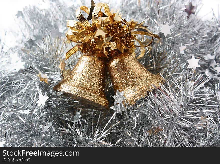 Christmas hand bells in a celebratory tinsel. Christmas hand bells in a celebratory tinsel