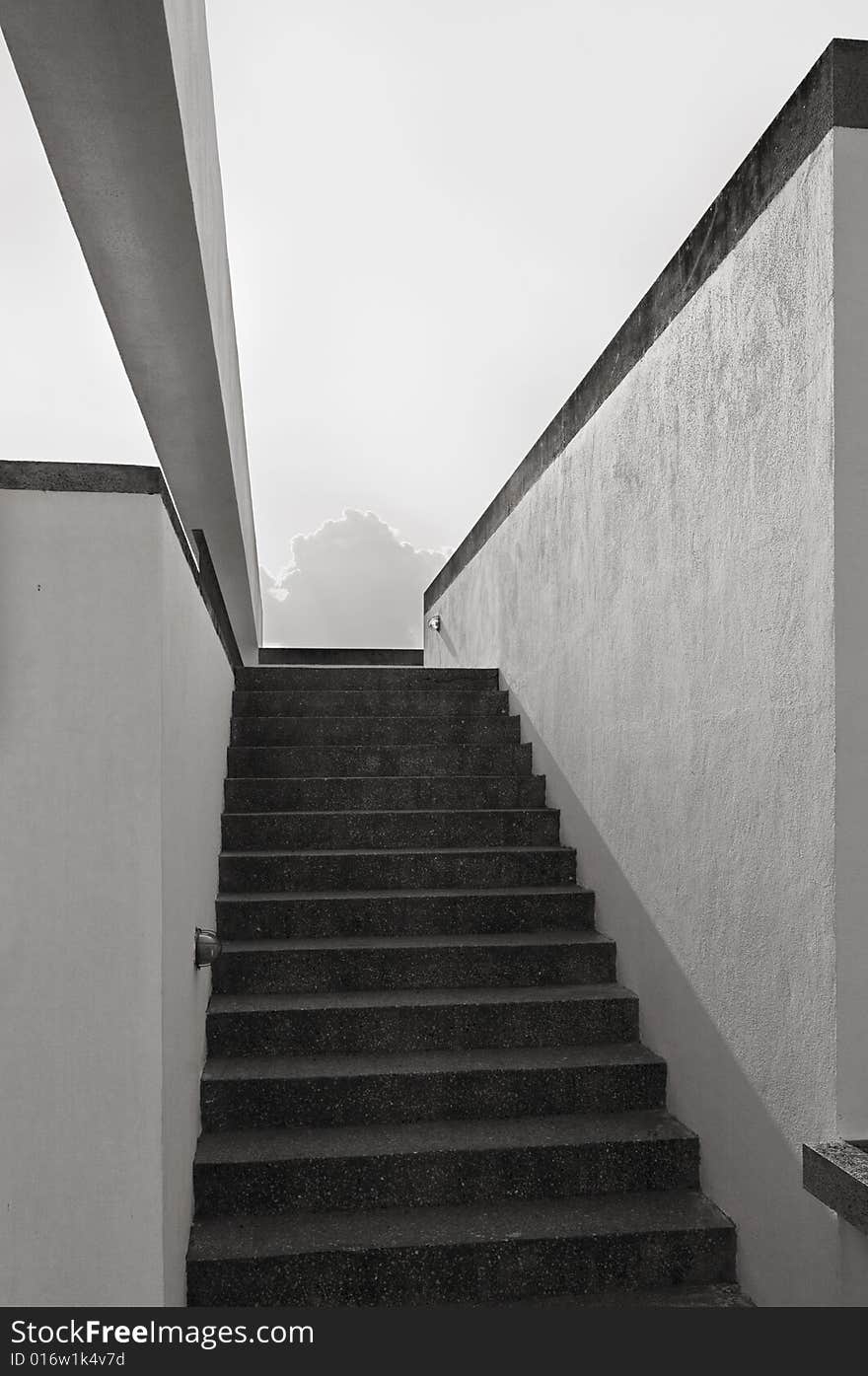 Narrow staircase in a modern building, monochrome