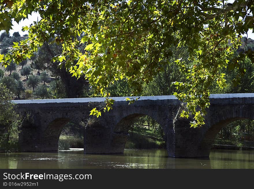 Old stone bridge in a peaceful park. Old stone bridge in a peaceful park