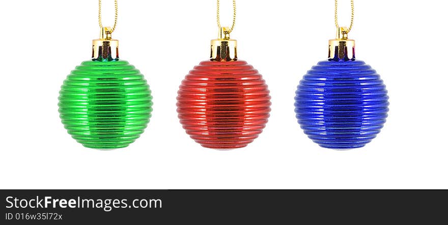 Trio christmas ornaments in blue, red and green - close up. Trio christmas ornaments in blue, red and green - close up