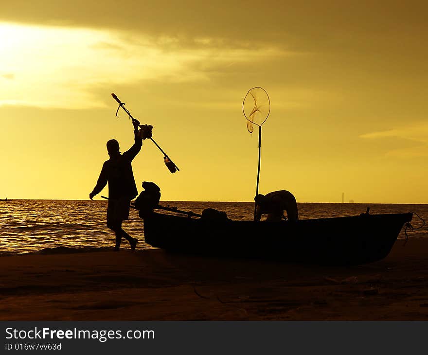 Fishermen and  fishing boat at sunset, Rayong Thailand. Fishermen and  fishing boat at sunset, Rayong Thailand