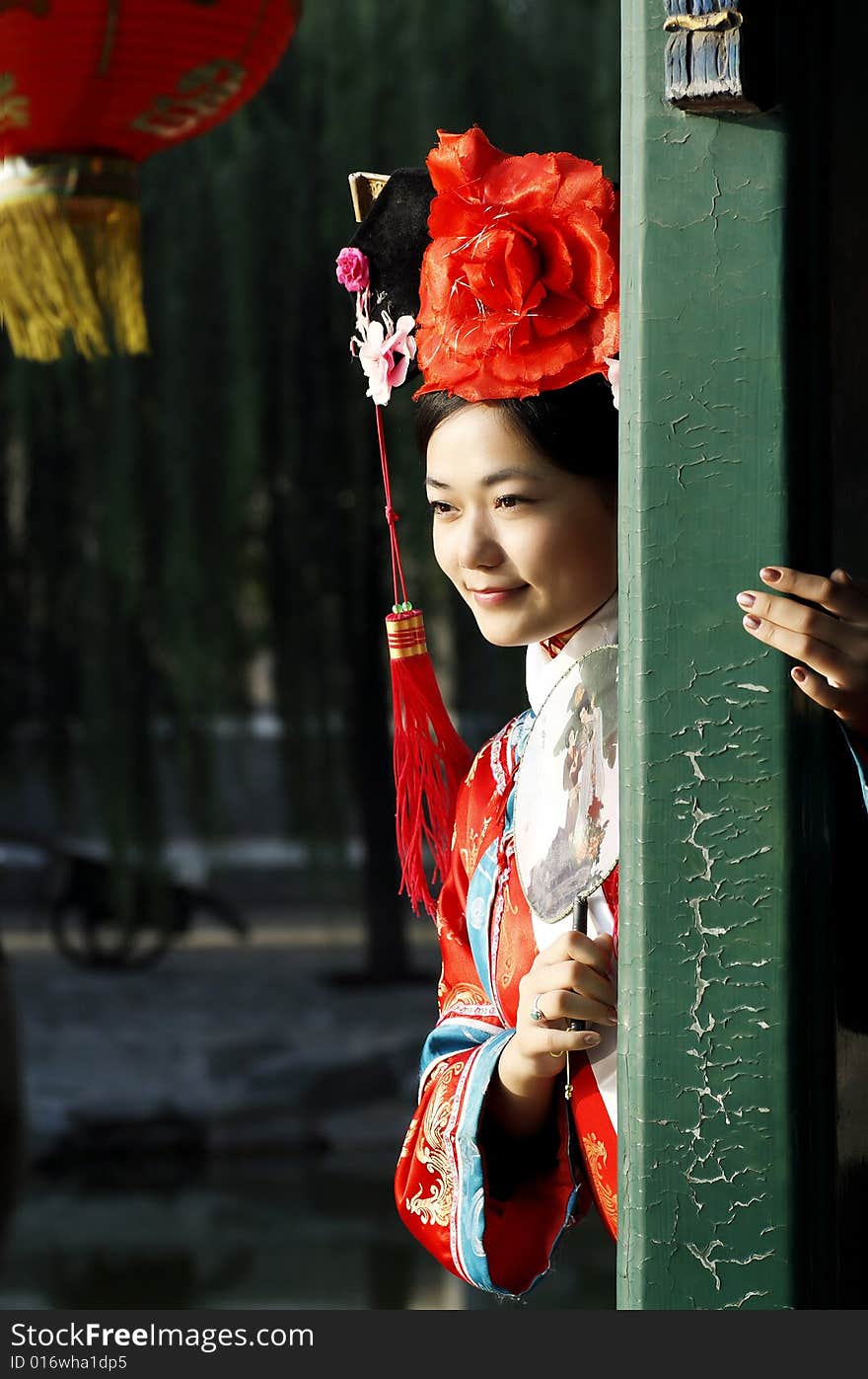 A beautiful girl in Chinese ancient dress is in the royal garden. This is dress of Qing Dynasty of China. It is the princess' dress too. Chinese on the fan is meant and missed. A beautiful girl in Chinese ancient dress is in the royal garden. This is dress of Qing Dynasty of China. It is the princess' dress too. Chinese on the fan is meant and missed.