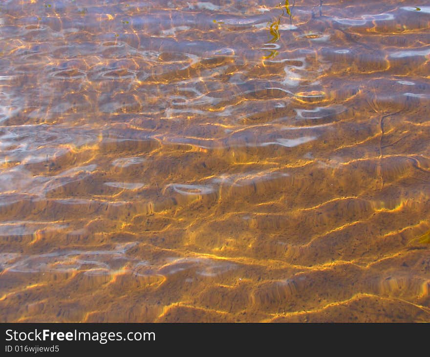 Transparent water and bottom of lake a background. Transparent water and bottom of lake a background