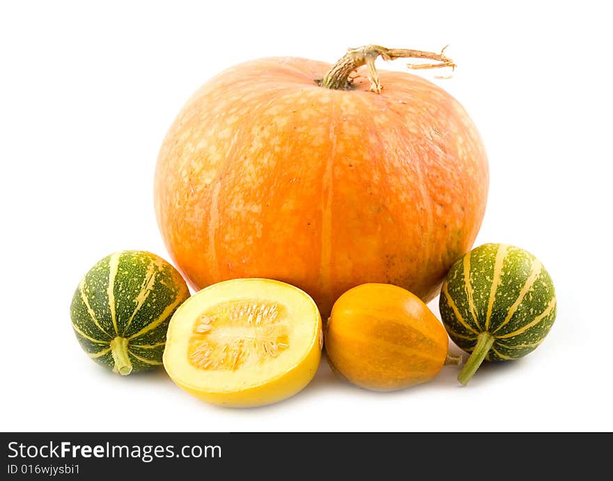 Decorative green and orange pumpkins with beautiful tasty pumpkin on  white background