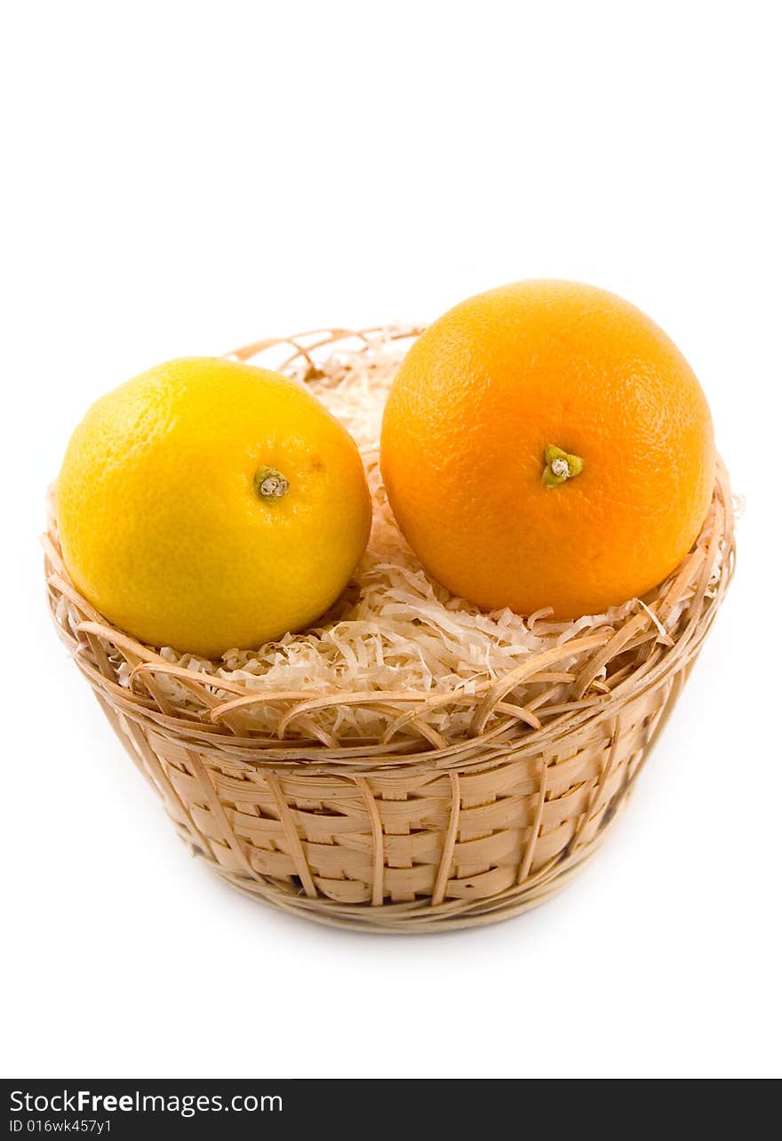 Plant tasty and useful orange with yellow beautiful lemon in basket on white background