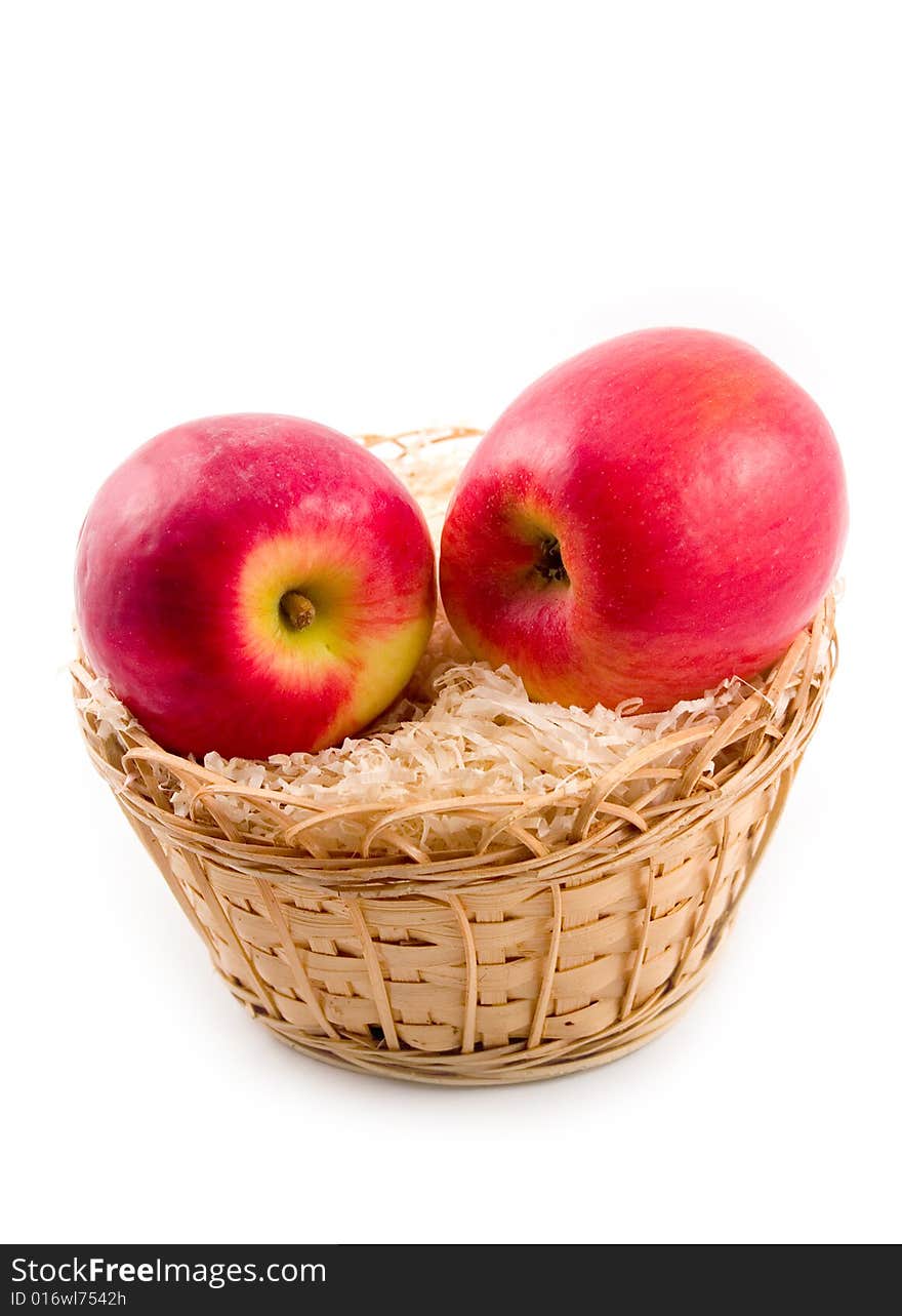 Ripe tasty and beautiful apples in yellow basket on white background. Ripe tasty and beautiful apples in yellow basket on white background