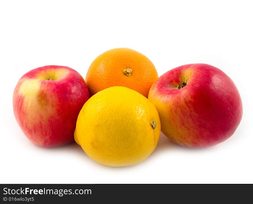 Beautiful and useful fruit orange red apples and yellow lemon on white background. Beautiful and useful fruit orange red apples and yellow lemon on white background