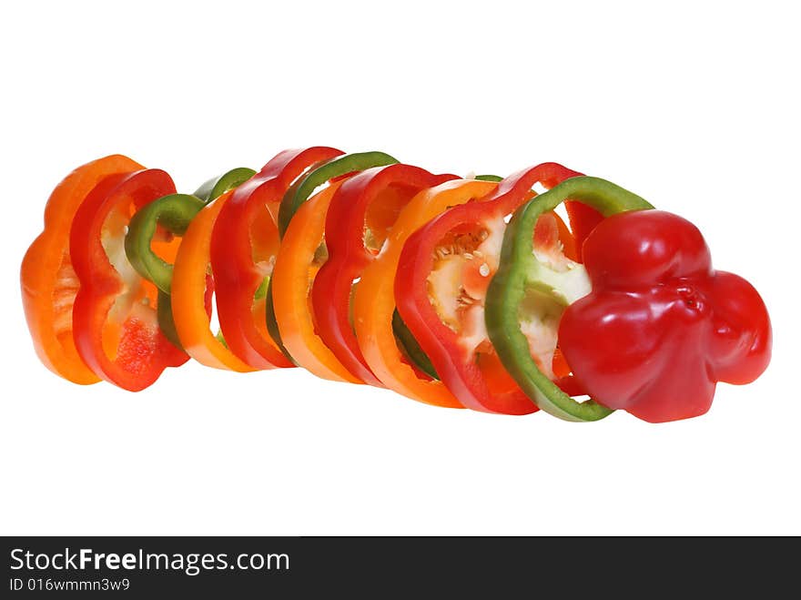 Sliced colorful peppers isolated on white background