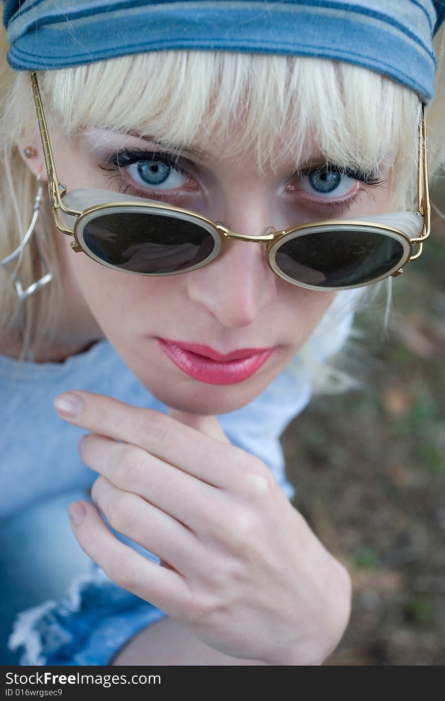 Portrait of a nice blue eyed girl wearing sunglasses. Portrait of a nice blue eyed girl wearing sunglasses