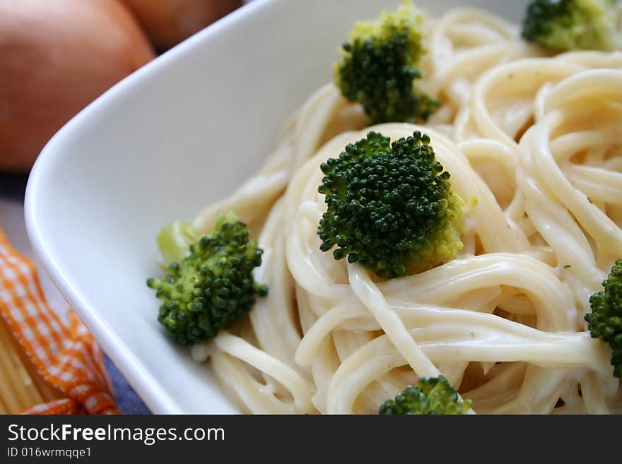 Italian noodles with cheese sauce and broccoli. Italian noodles with cheese sauce and broccoli