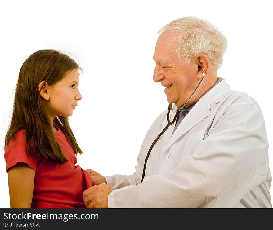 Senior doctor examining a young girl patient. Senior doctor examining a young girl patient