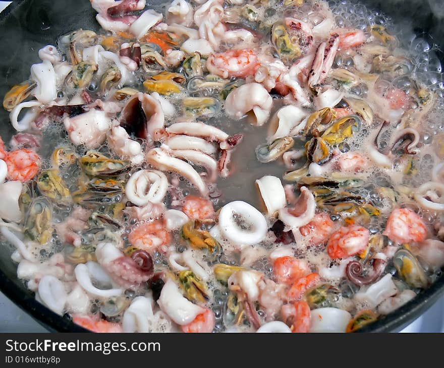 Close up of the seafood on the frying pan. Close up of the seafood on the frying pan.