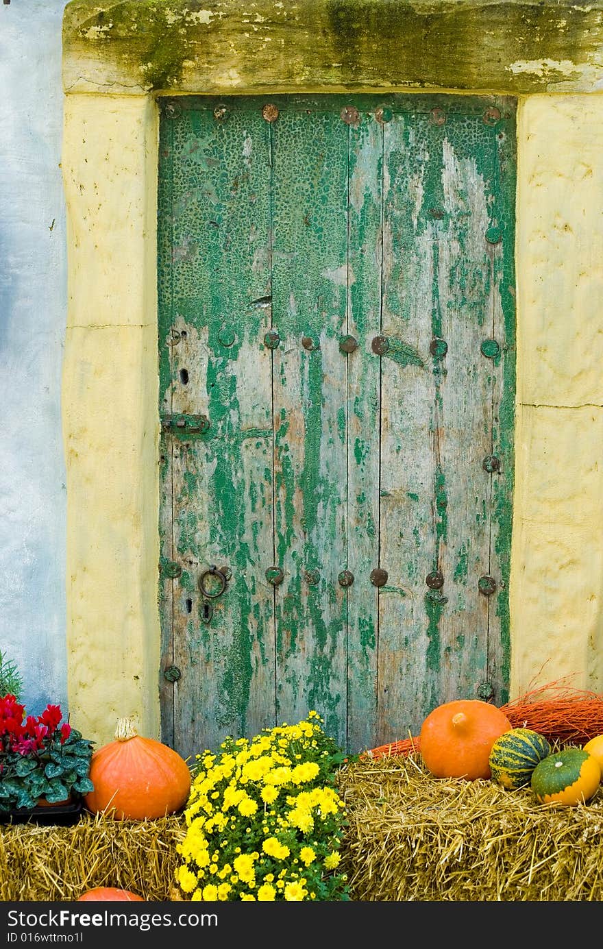 A shot of a door with autumn decoration. A shot of a door with autumn decoration