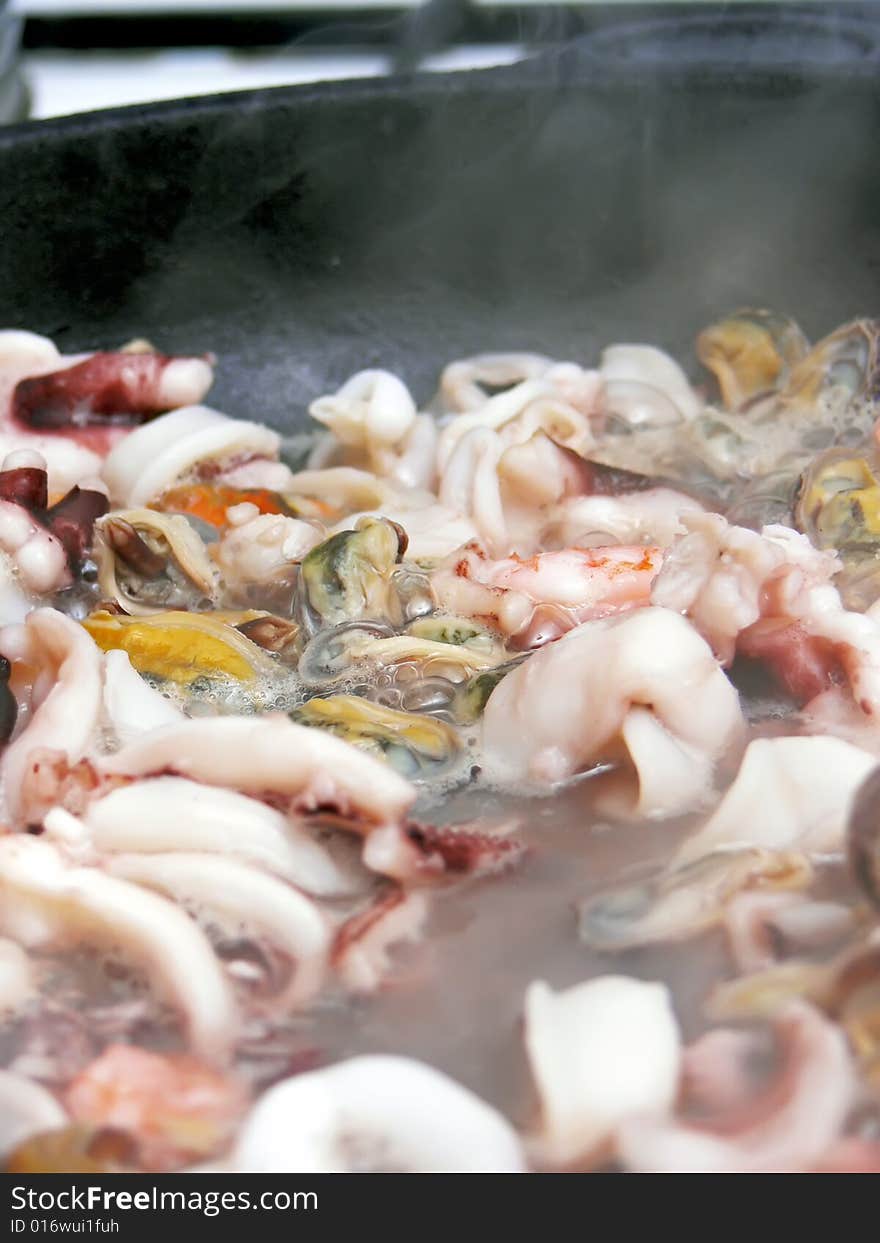 Close up of the seafood on the frying pan. Close up of the seafood on the frying pan.