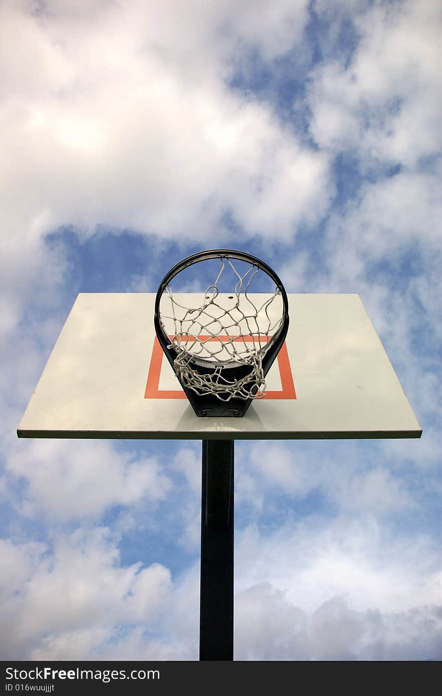 Outdoor basketball goal with sky background. Outdoor basketball goal with sky background