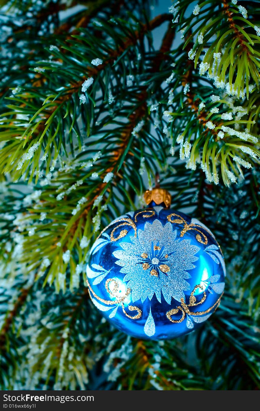 New-year tree blue decoration on green branch. New-year tree blue decoration on green branch