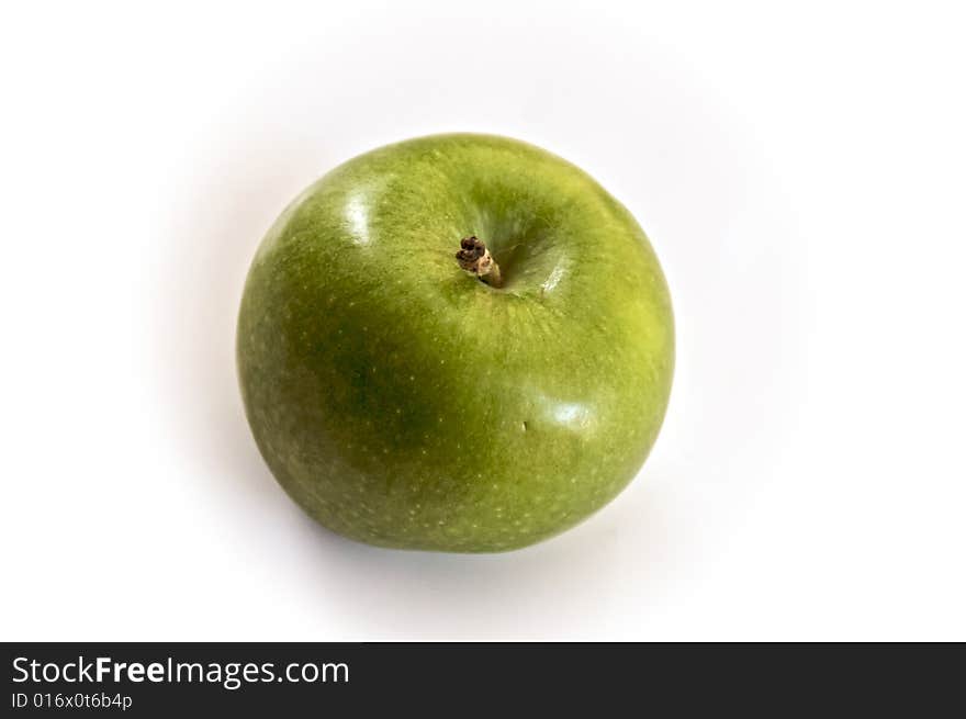 One granny smith apple seen from above