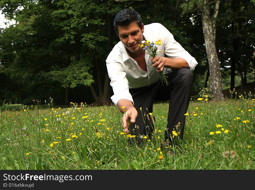 Man picking flowers for valentine. Man picking flowers for valentine