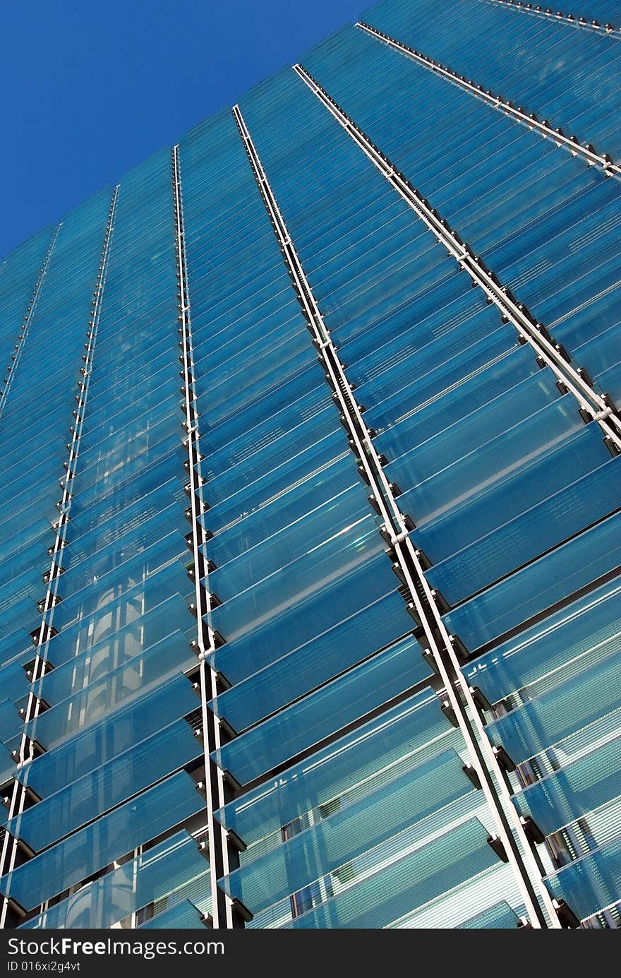 Detail view of some glass sunshades of a modern building. Detail view of some glass sunshades of a modern building.