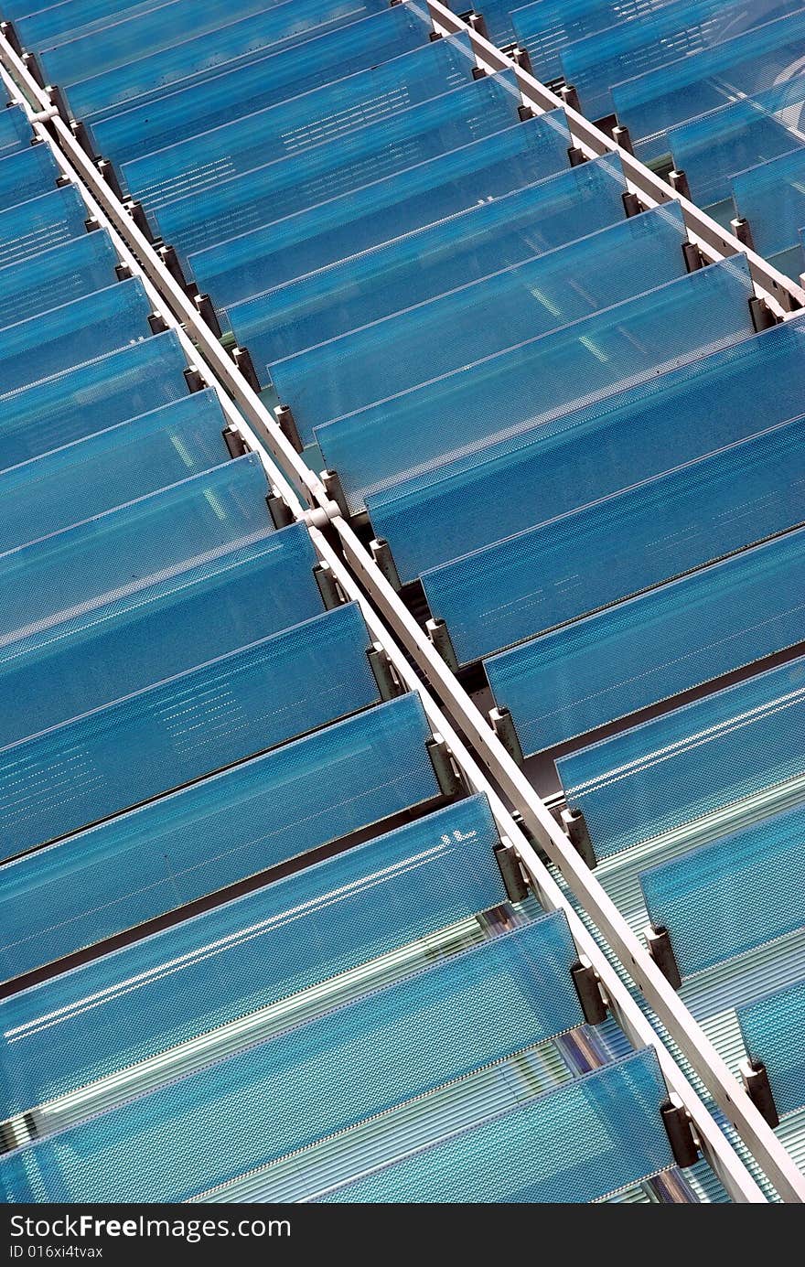 Detail view of some glass sunshades of a modern building. Detail view of some glass sunshades of a modern building.