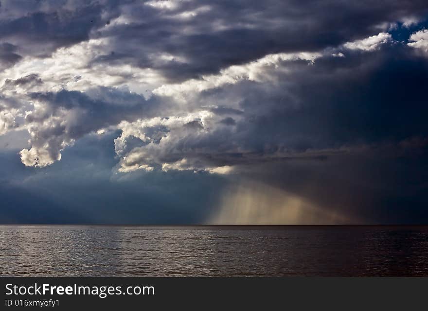 Sea and dark storm cloud. Sea and dark storm cloud