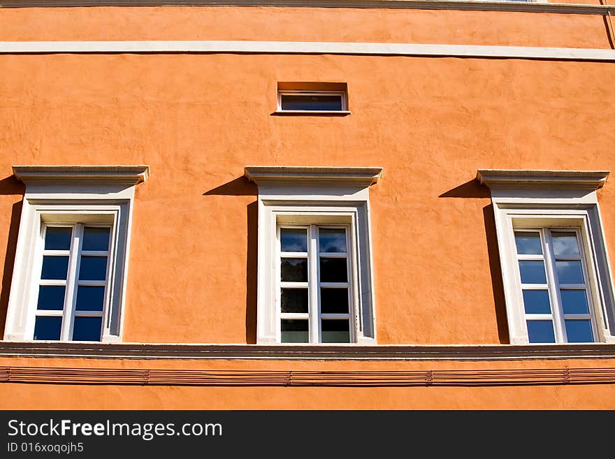 Windows on orange wall in Rome, Italy. Windows on orange wall in Rome, Italy