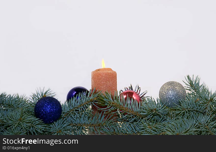 Branches of a blue spruce with Christmas toys