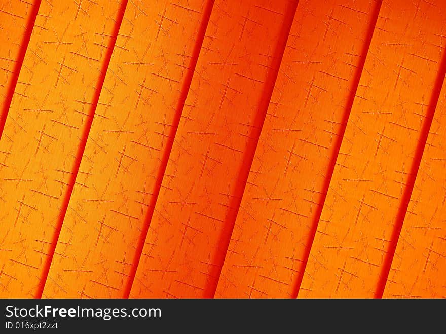 Orange background texture with red lines and dark shadows