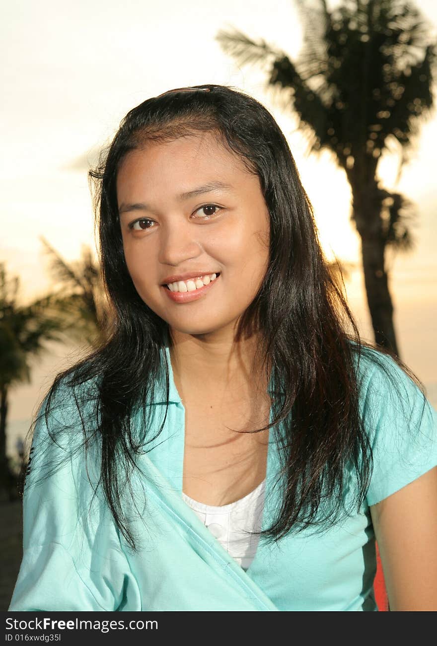 Photograph of sweet asian girl with backlight