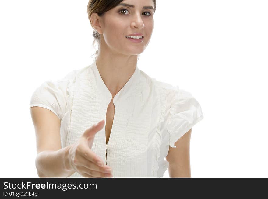 Young woman offering hand shake against white background