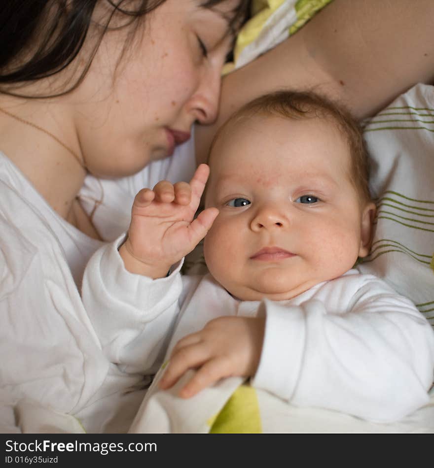 Baby with mom in the bed. Baby with mom in the bed