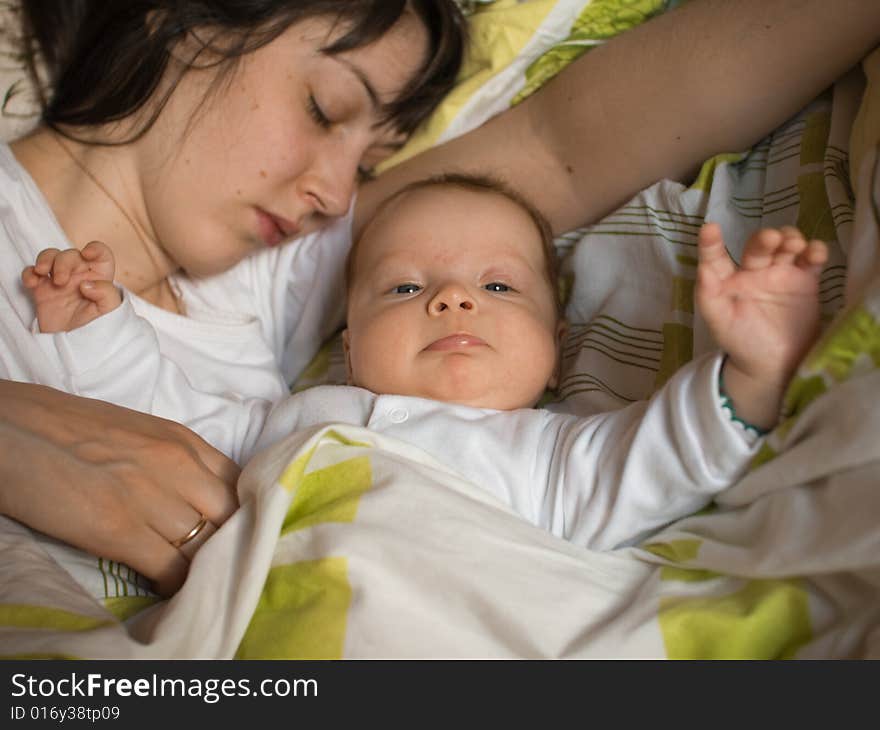 Baby with mom in the bed. Baby with mom in the bed