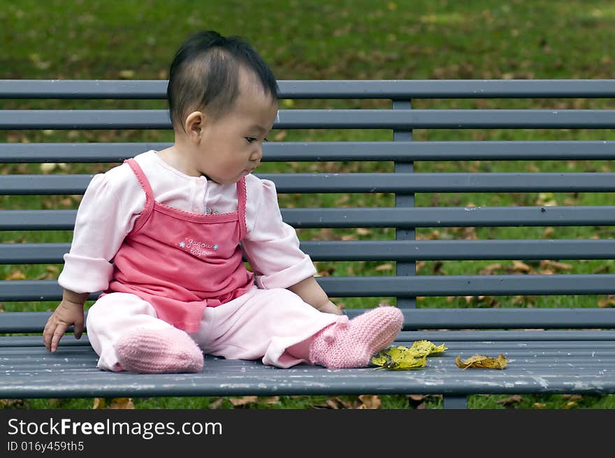 Chinese baby on the bench