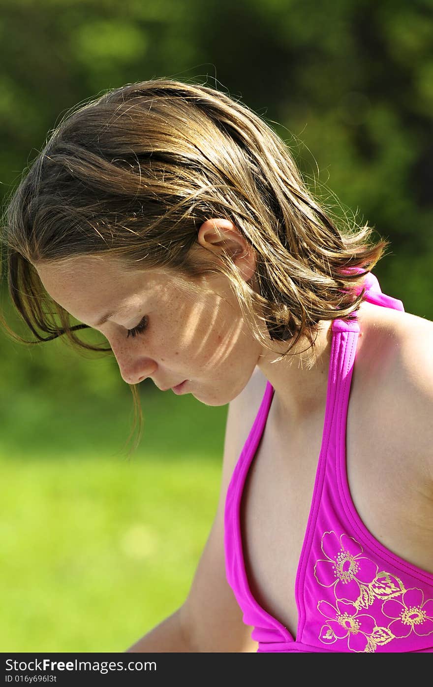 Outdoor profile of girl in pink