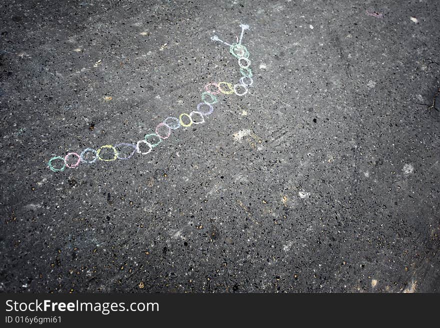 Background made of kid's chalk drawing on asphalt. Background made of kid's chalk drawing on asphalt