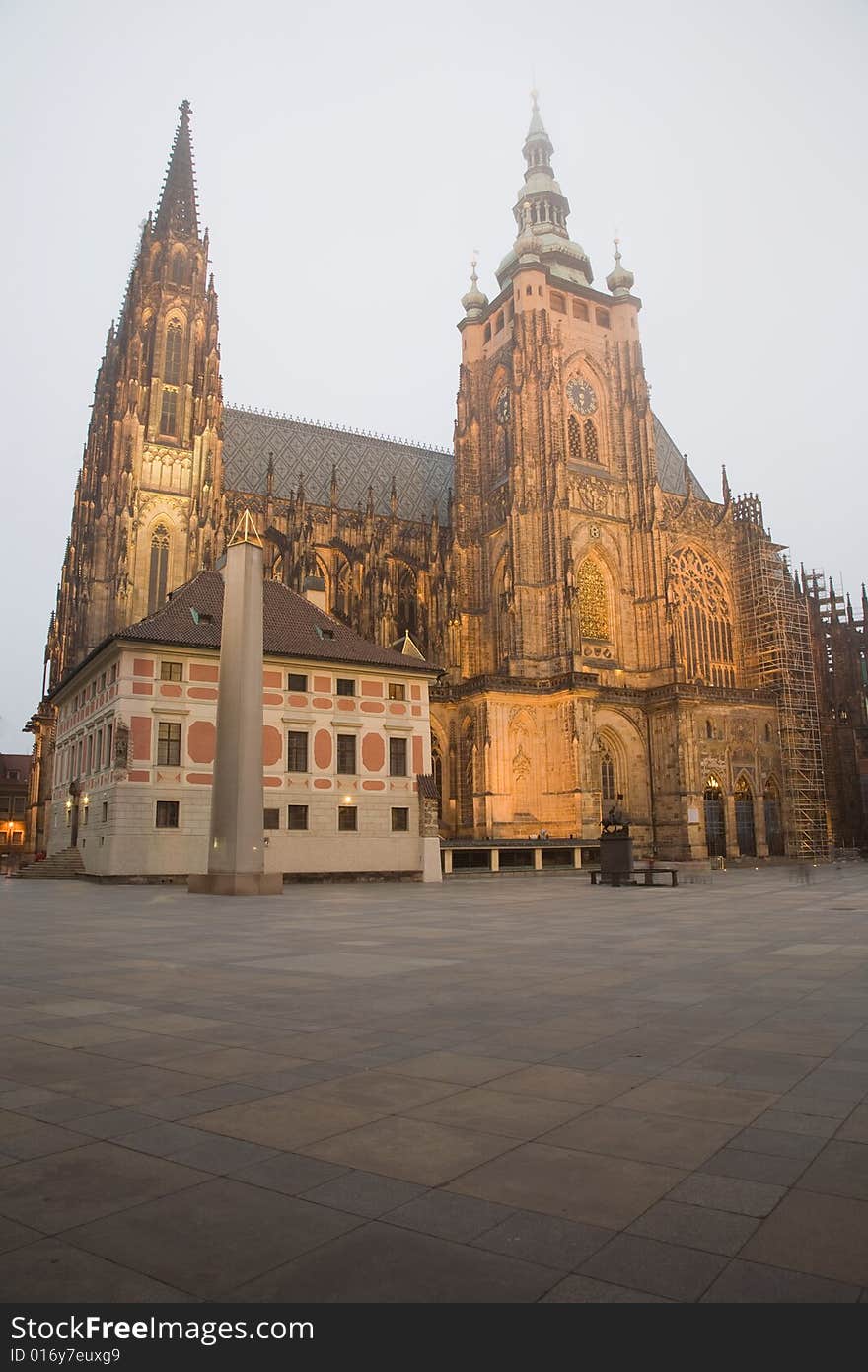 Gothic towers of the famous cathedral of St. Vitus in Prague are touching the fog. Gothic towers of the famous cathedral of St. Vitus in Prague are touching the fog.