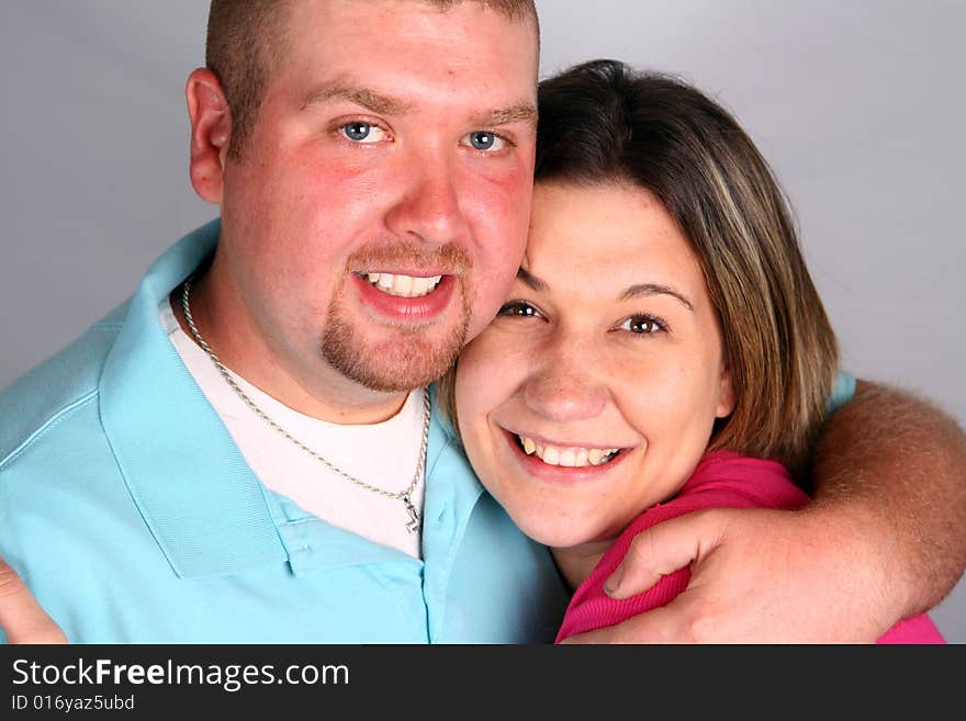 Man and Woman Hugging and Smiling