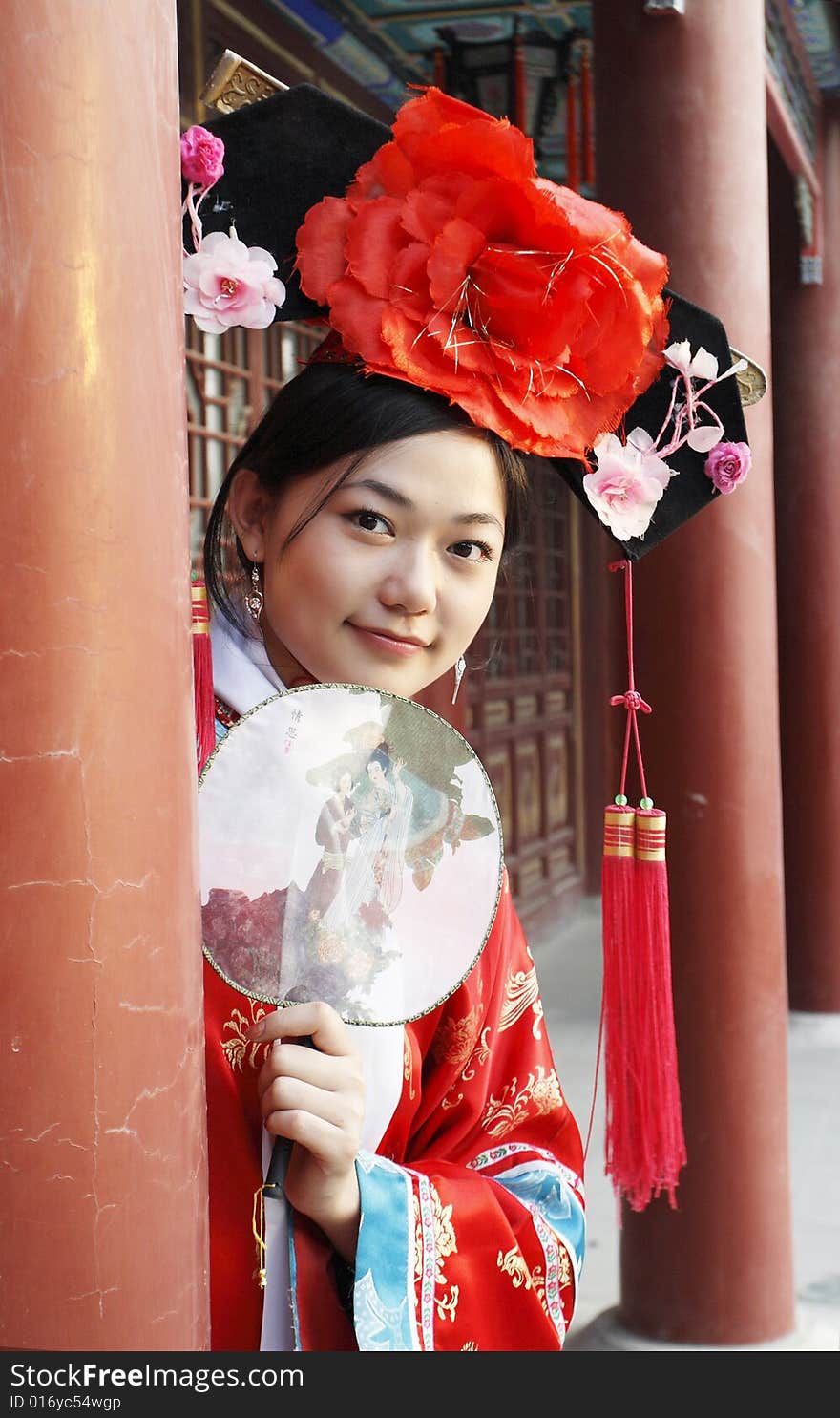 A beautiful girl in Chinese ancient dress is in the royal garden.

Chinese on the fan is meant and missed. 

This is dress of Qing Dynasty of China. It is the princess' dress too. A beautiful girl in Chinese ancient dress is in the royal garden.

Chinese on the fan is meant and missed. 

This is dress of Qing Dynasty of China. It is the princess' dress too.