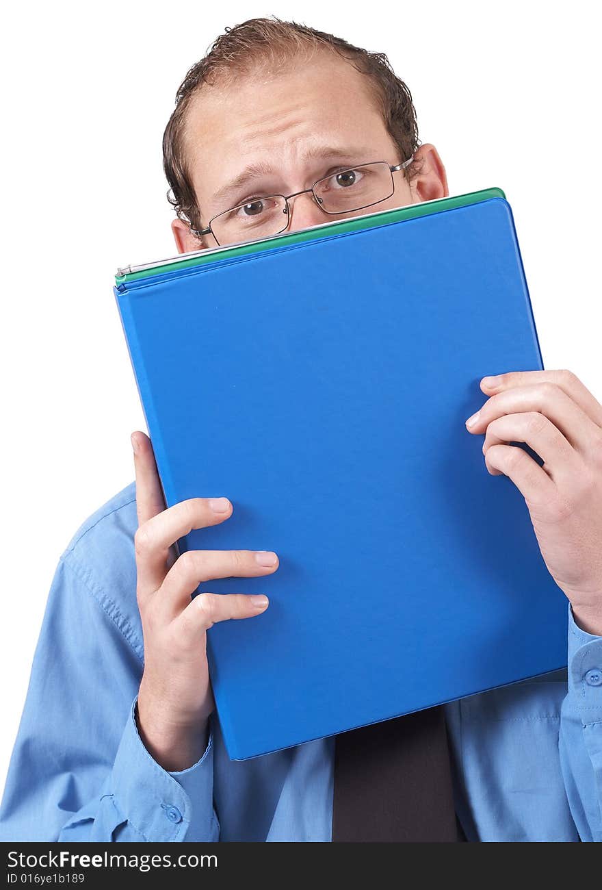 Young successful businessman wearing office clothes hiding behind the folder, looking terrified. Isolated on white background. Young successful businessman wearing office clothes hiding behind the folder, looking terrified. Isolated on white background