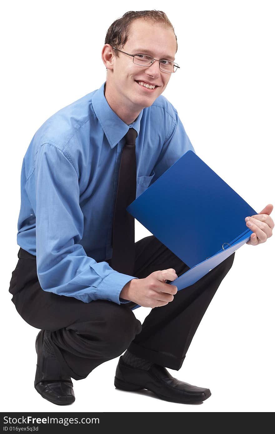 Young successful businessman wearing office clothes sitting with folder. Isolated on white background. Young successful businessman wearing office clothes sitting with folder. Isolated on white background