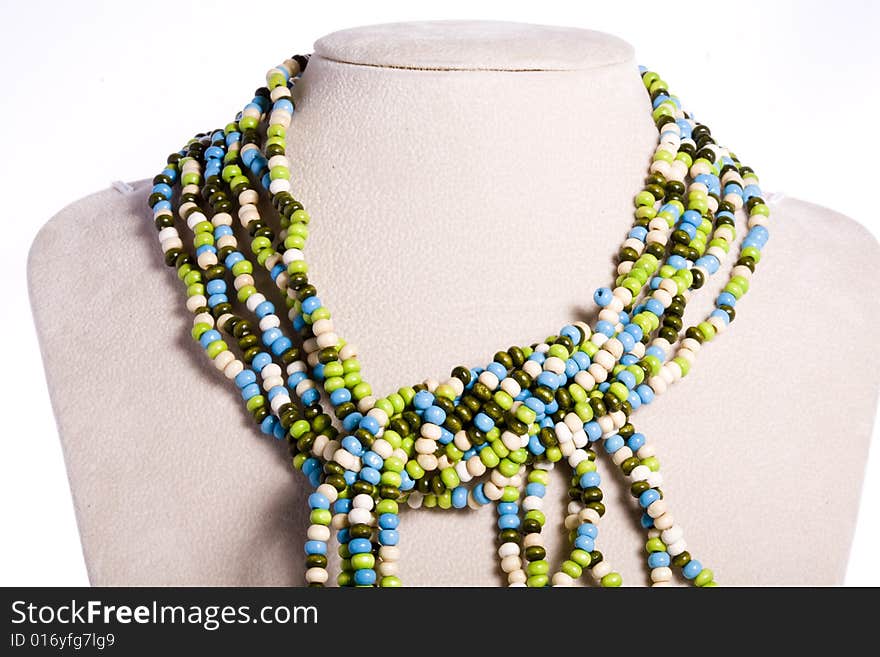 Colorful beads made necklace with self-standing display on white background