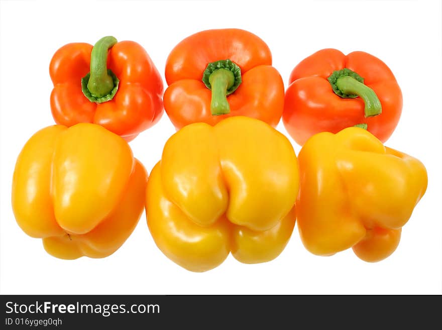 Yellow and orange peppers on white